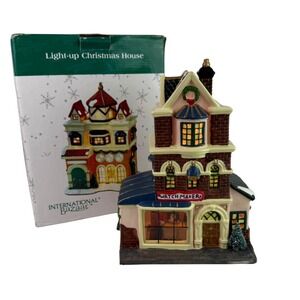 International Bazaar Light‎ Up Christmas House Watch Maker Village Collectible